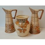 A pair of Charlotte Rhead water jugs and A Crown Devon vase