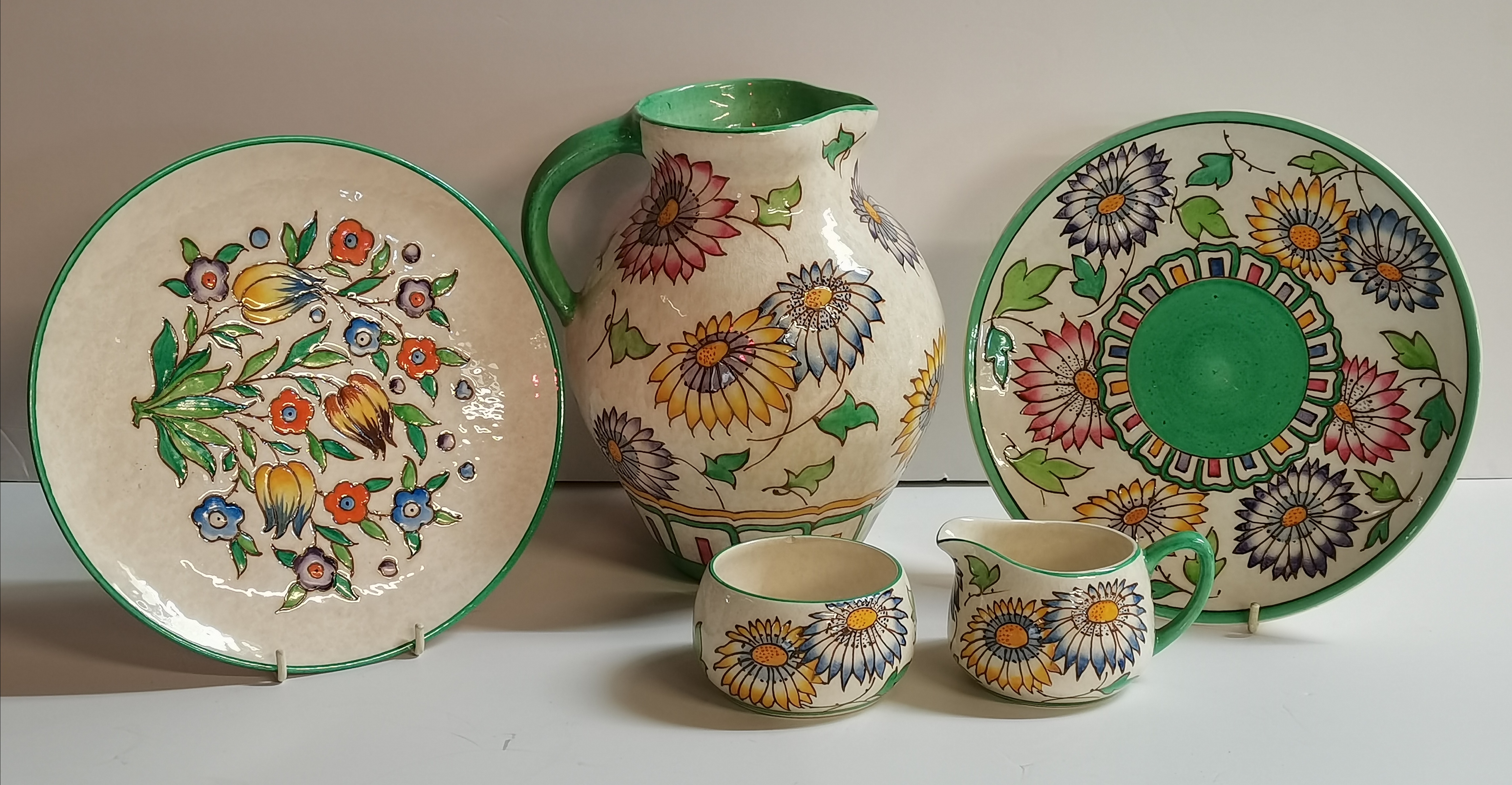 A collection of CHARLOTTE RHEAD with floral decoration