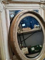 Cream framed wall mirror and gilt oval wall mirror