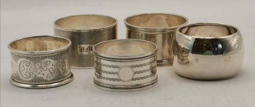 A harlequin group of five silver napkin rings