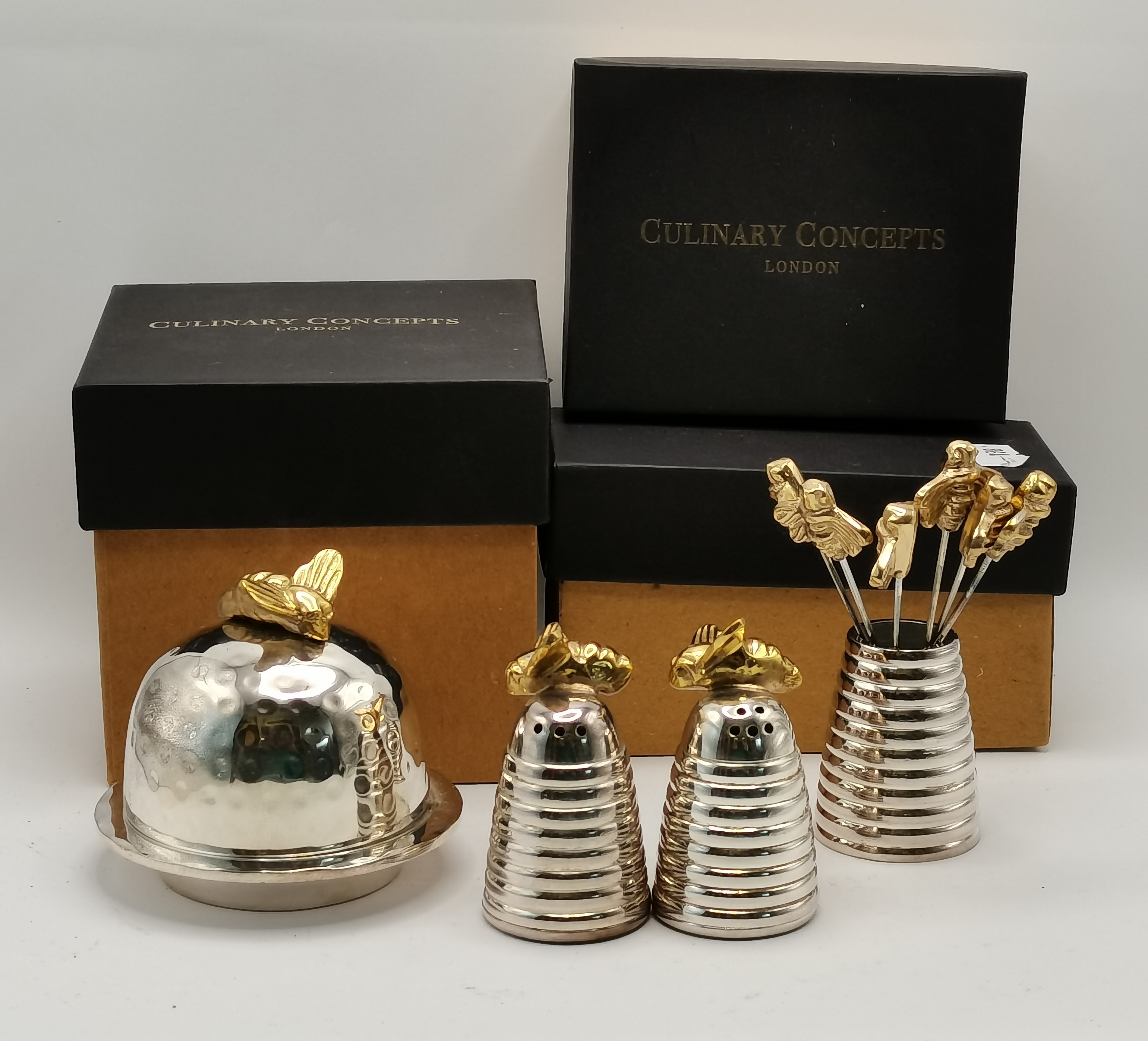 A group of silver-plated 'Queen Bee' table items by Culinary Concepts