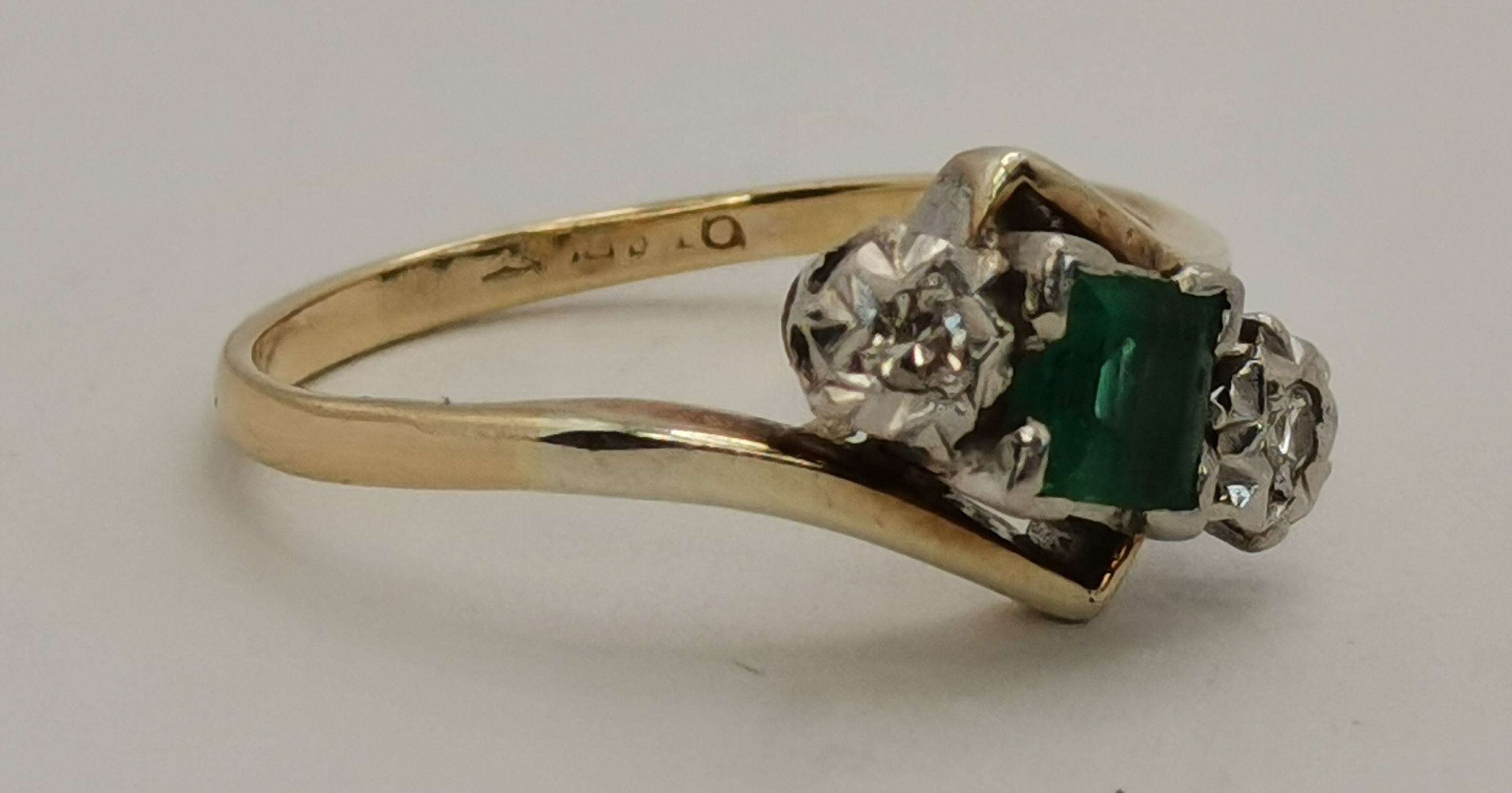 A 9 carat gold and platinum emerald and diamond three-stone crossover ring - Image 2 of 5