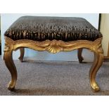 An Antique gilt cabriole legged stool with newly r