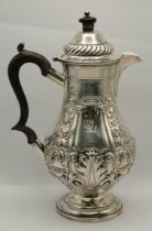 A late Victorian silver hot water jug