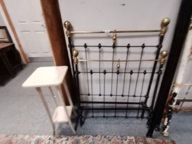 A brass and iron single bed frame, black painted, with side bars. Headboard 122cm high, 92cm wide pl