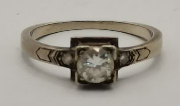 A 19 carat white gold white stone ring
