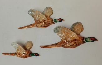 A set of Beswick flying Pheasants 661