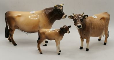 A Beswick Jersey cow group