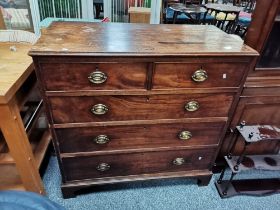 A Georgian mahogany straight fronted 4 height chest with bracket feet