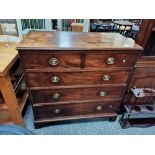 A Georgian mahogany straight fronted 4 height chest with bracket feet