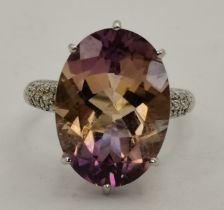 A 9 carat white gold and lilac stone dress ring