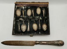 A Victorian silver cake knife and a cased set of six late Victorian gilded teaspoons