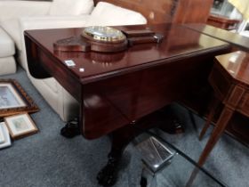 An Antique mahogany sofa table with claw feet plus