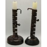 Two French 'rat de cave' wrought iron candlesticks, early-mid 19th Century