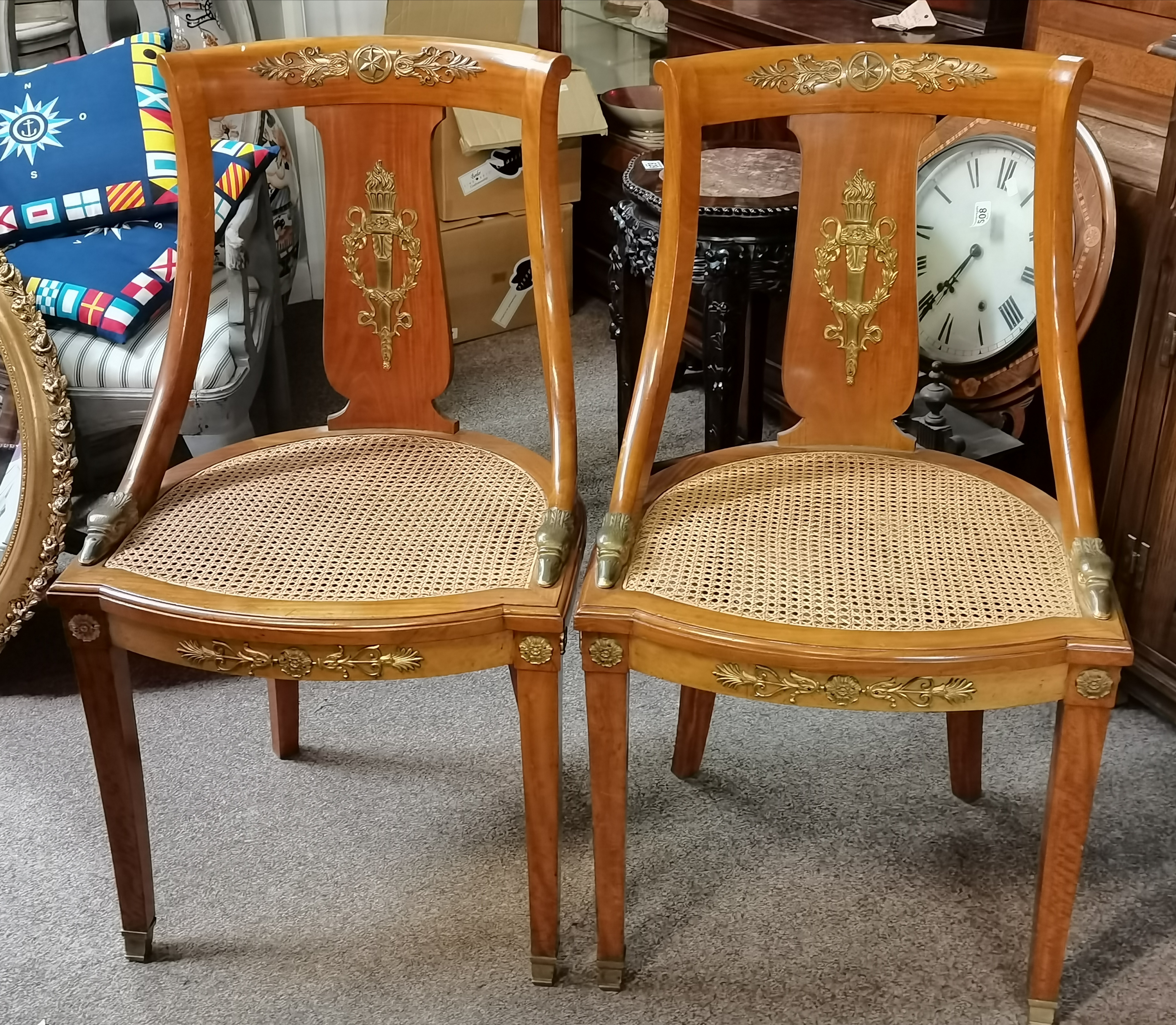 A fine pair of fruitwood and canework hall chairs