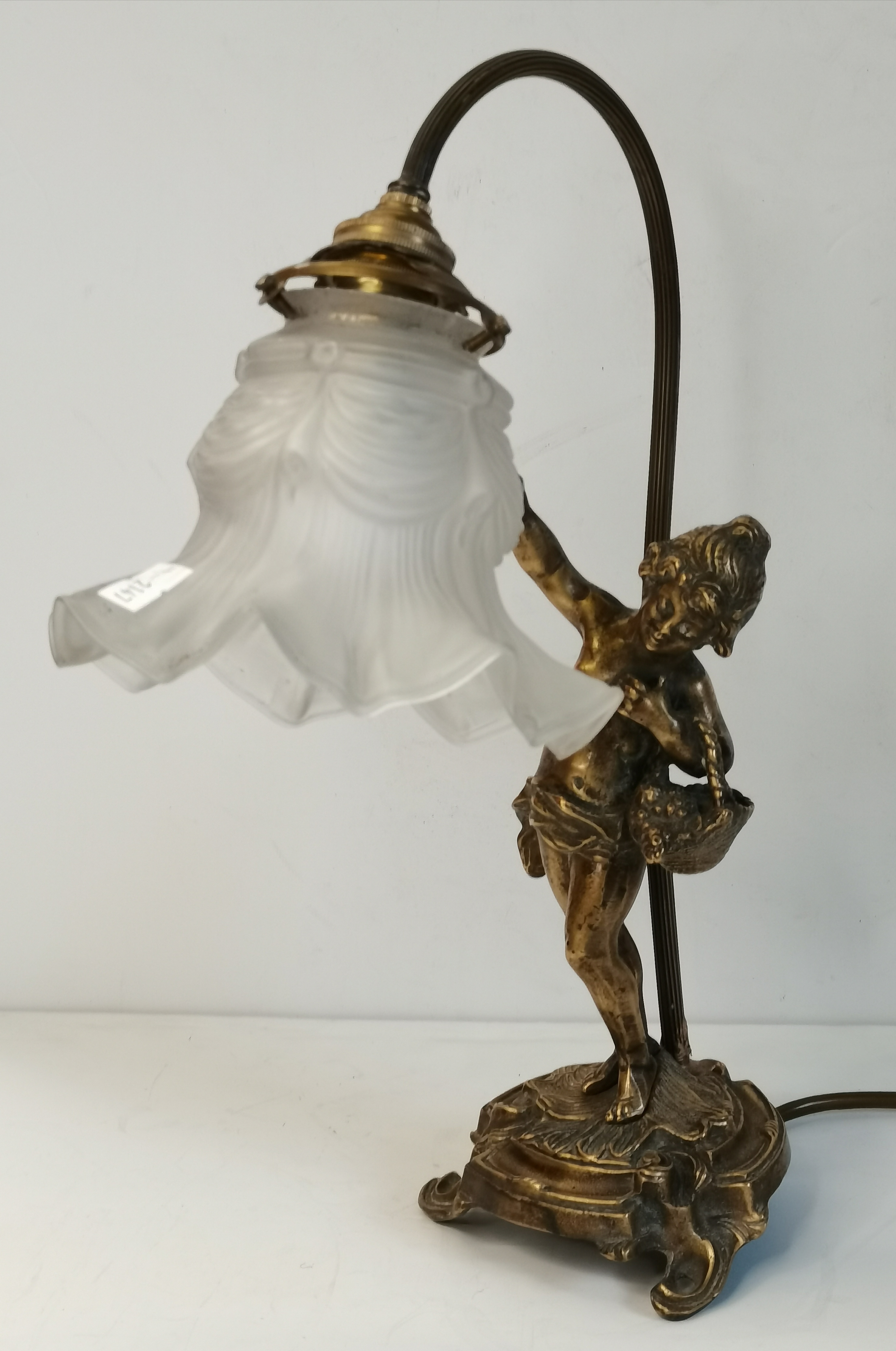 A French figural brass table lamp