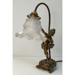 A French figural brass table lamp