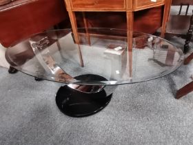 A modern glass and chrome coffee table