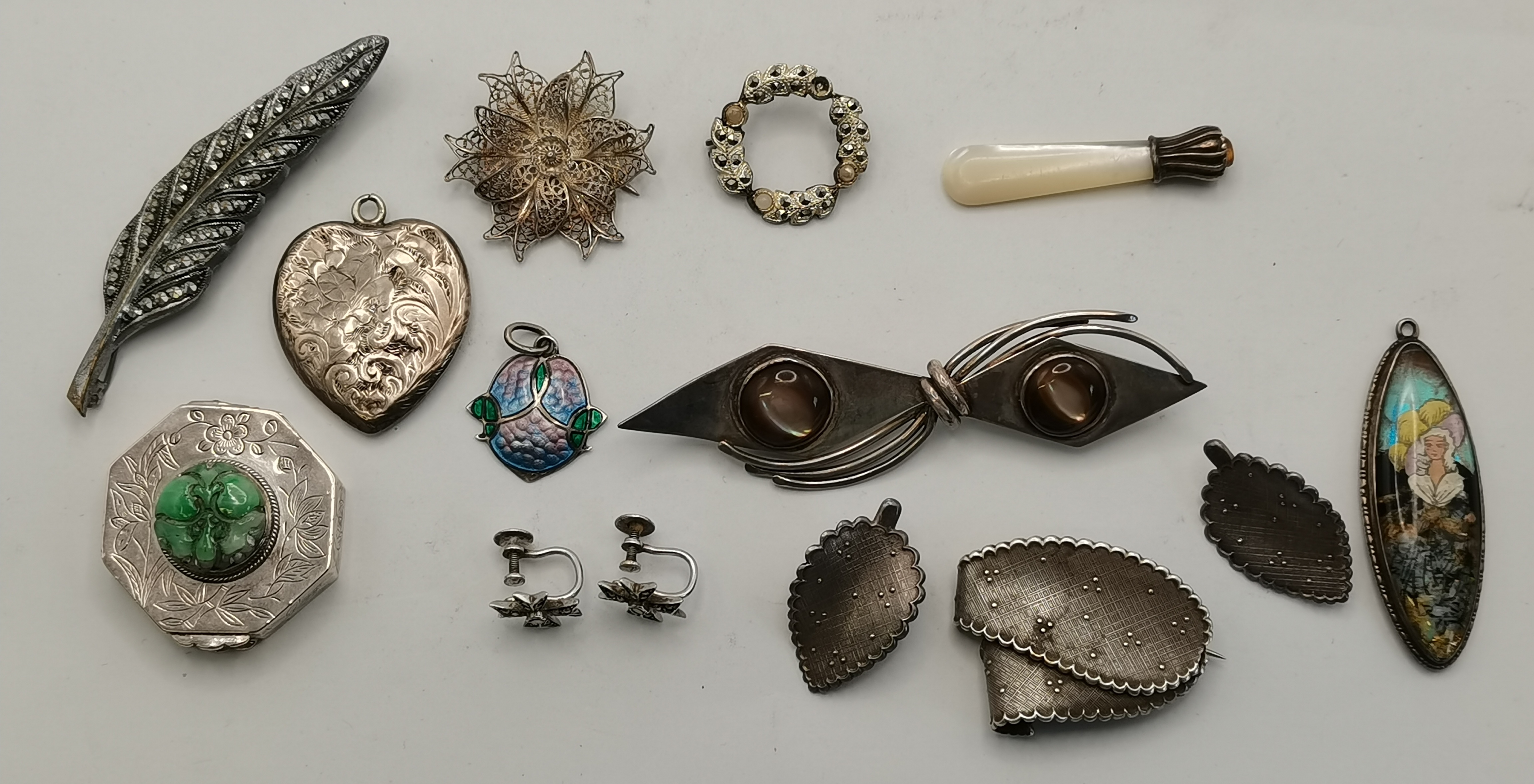 A group of silver and white metal jewellery, etc.