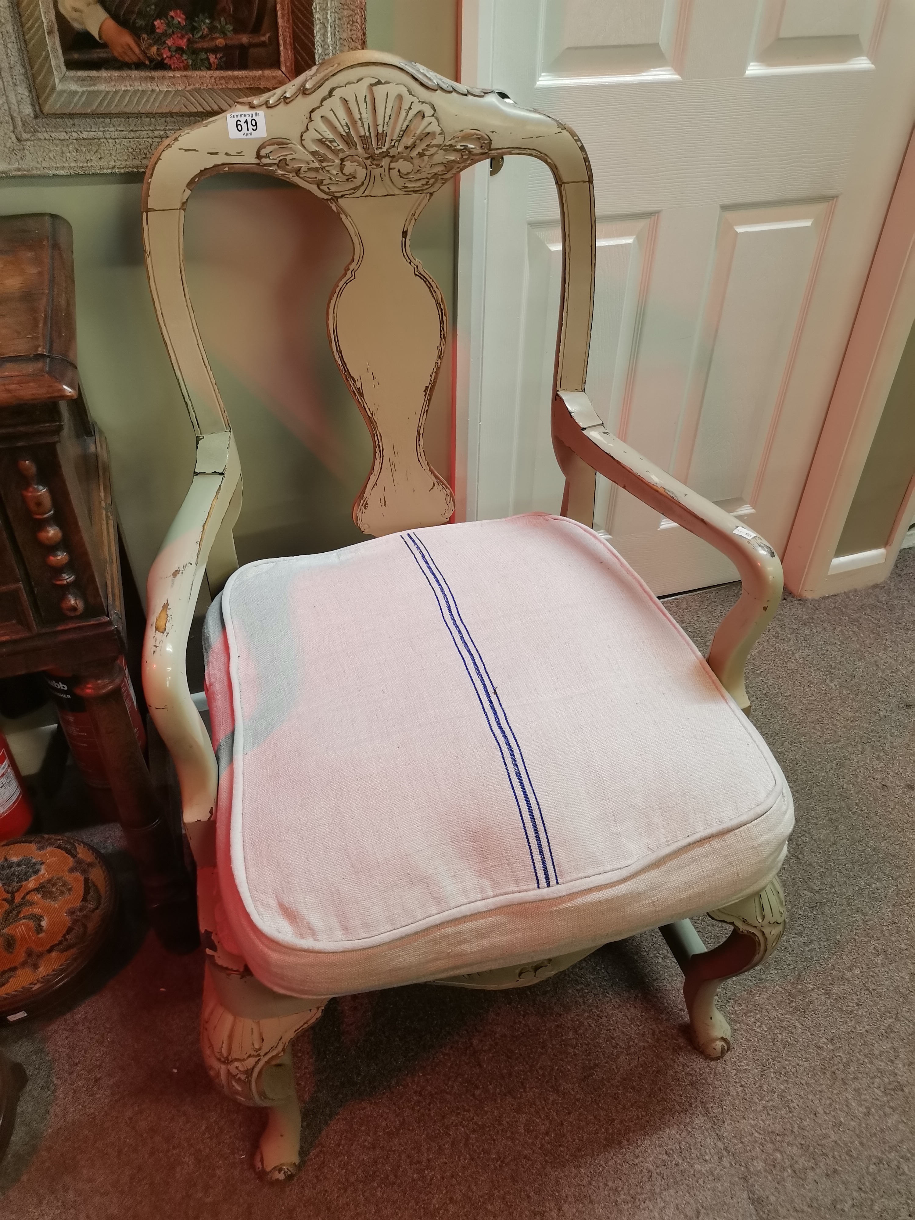 A Swedish style shabby chic armchair