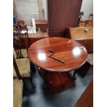 An Antique mahogany oval extending dining table with handle and 2 x leaves