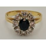 An 18 carat gold diamond and sapphire cluster ring