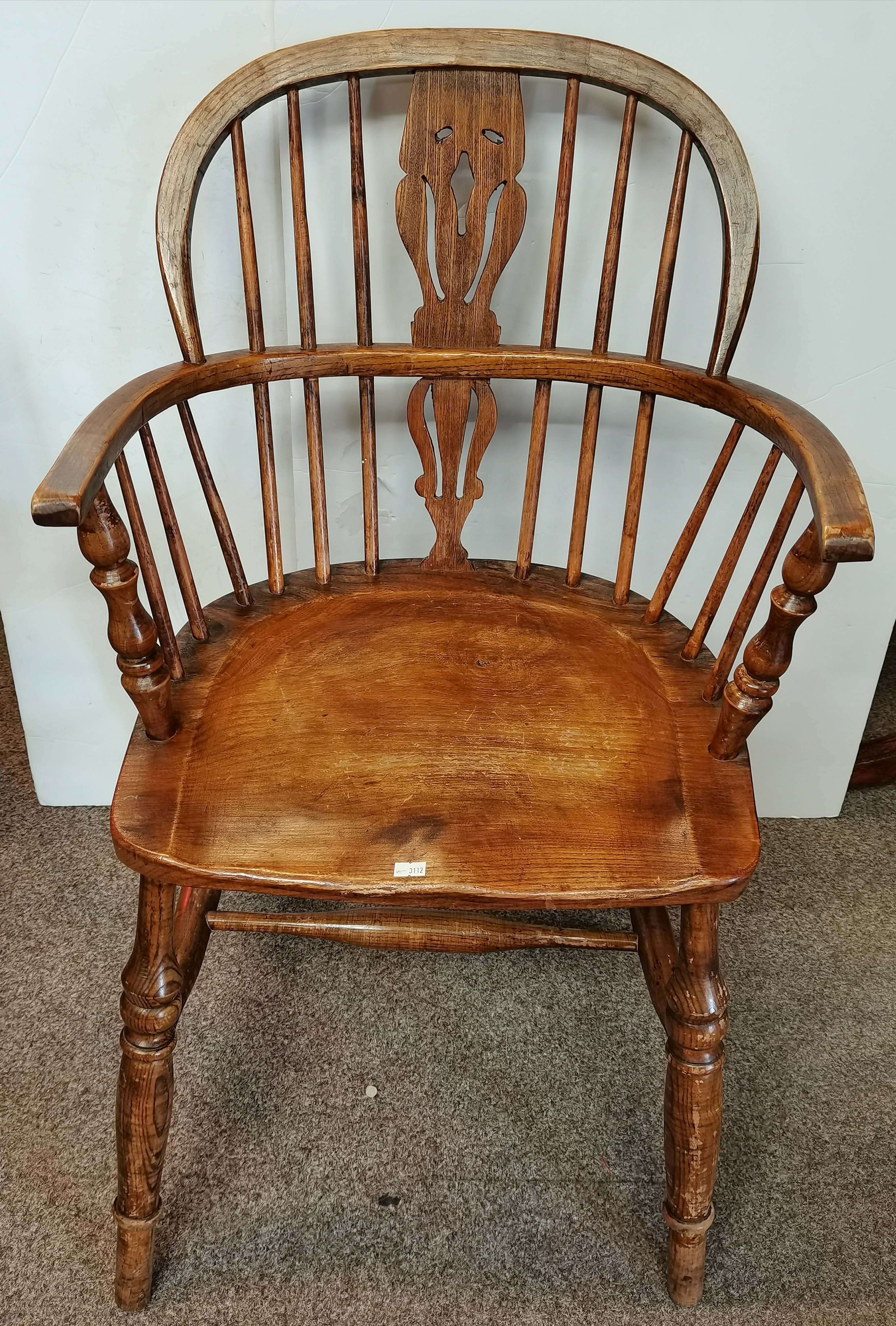A low back Windsor chair with turned stretchers
