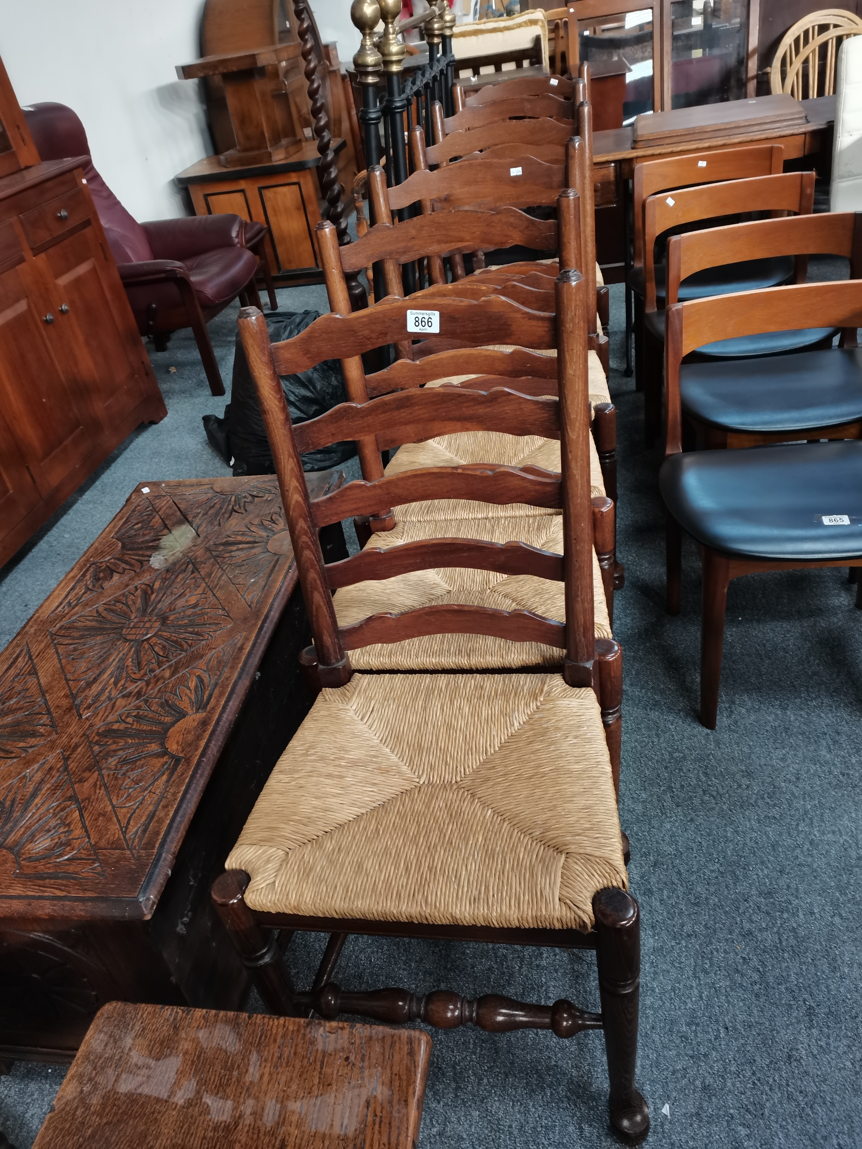 A set of 6 oak ladder back dining chairs