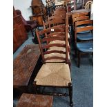 A set of 6 oak ladder back dining chairs