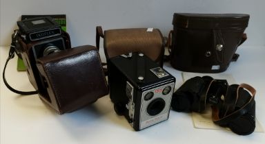 Ikonta camera, Kodak Brownie Flash III camera and binoculars all in original cases