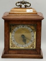 A Goldsmiths & Silversmiths Co walnut mantel clock