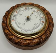 An oak-mounted aneroid barometer, 20th Century