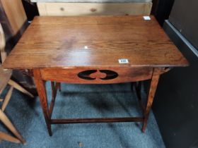 An Arts and crafts style oak side table