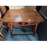 An Arts and crafts style oak side table