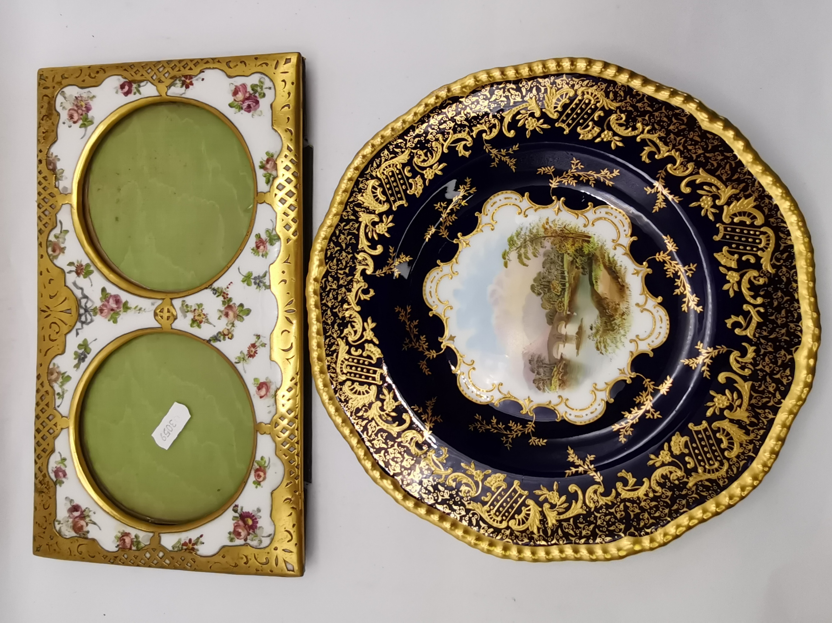 A Coalport cabinet plate, and a French porcelain and gilt-metal twin photograph frame