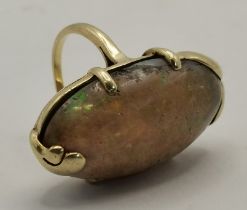 Seaman Shepps: A large cabochon opal ring, American, early 20th Century