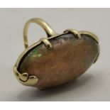 Seaman Shepps: A large cabochon opal ring, American, early 20th Century