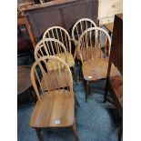 A set of 4 plus carver Ercol chairs