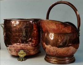 A copper coal scuttle, and a copper twin-handled jardinière