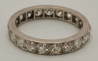 A platinum and diamond eternity ring
