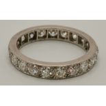 A platinum and diamond eternity ring