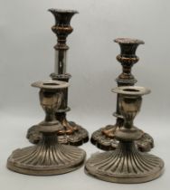 A pair of Old Sheffield Plate extending candlesticks, and another pair of silver-plated sticks