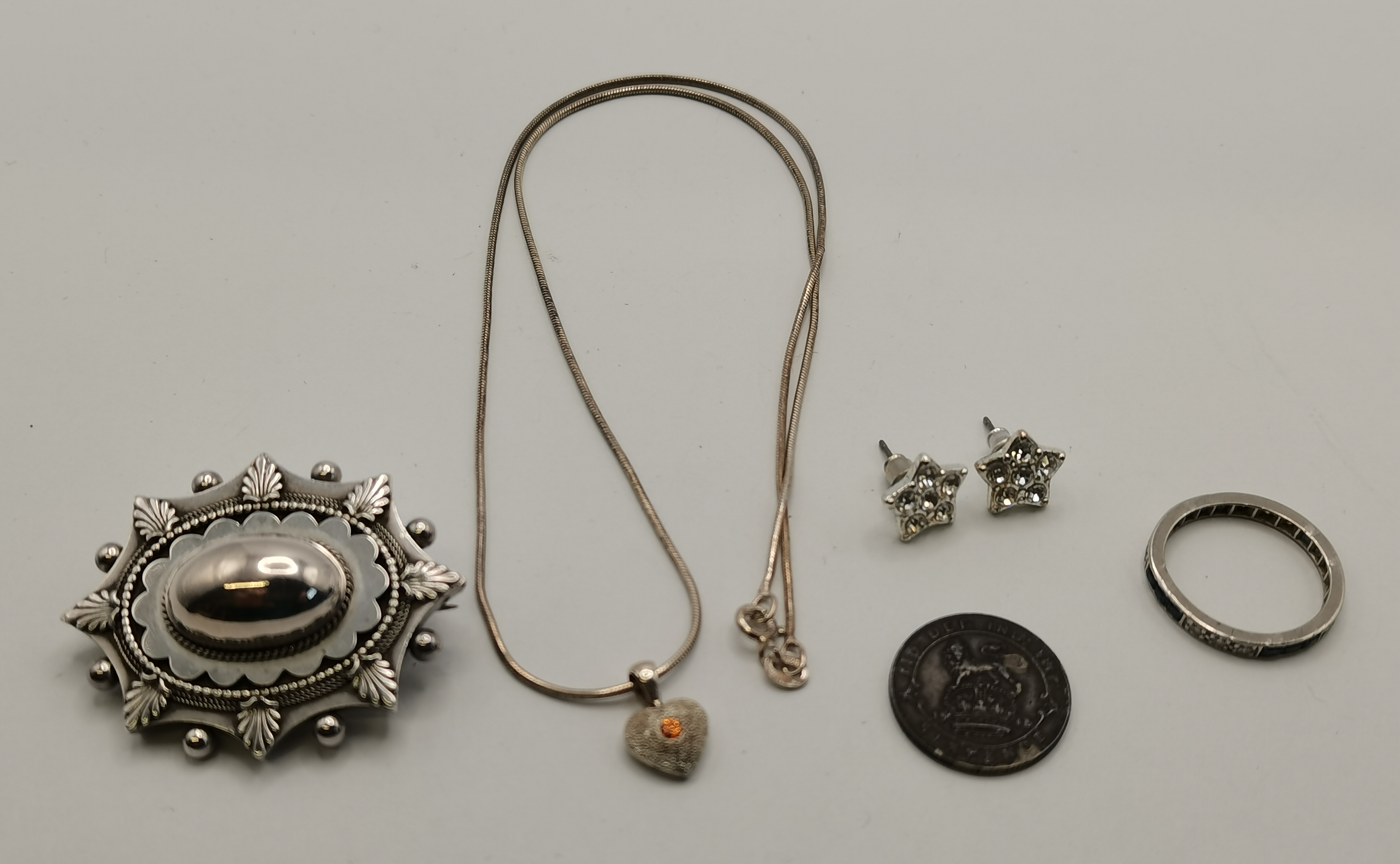 A collection of white metal jewellery