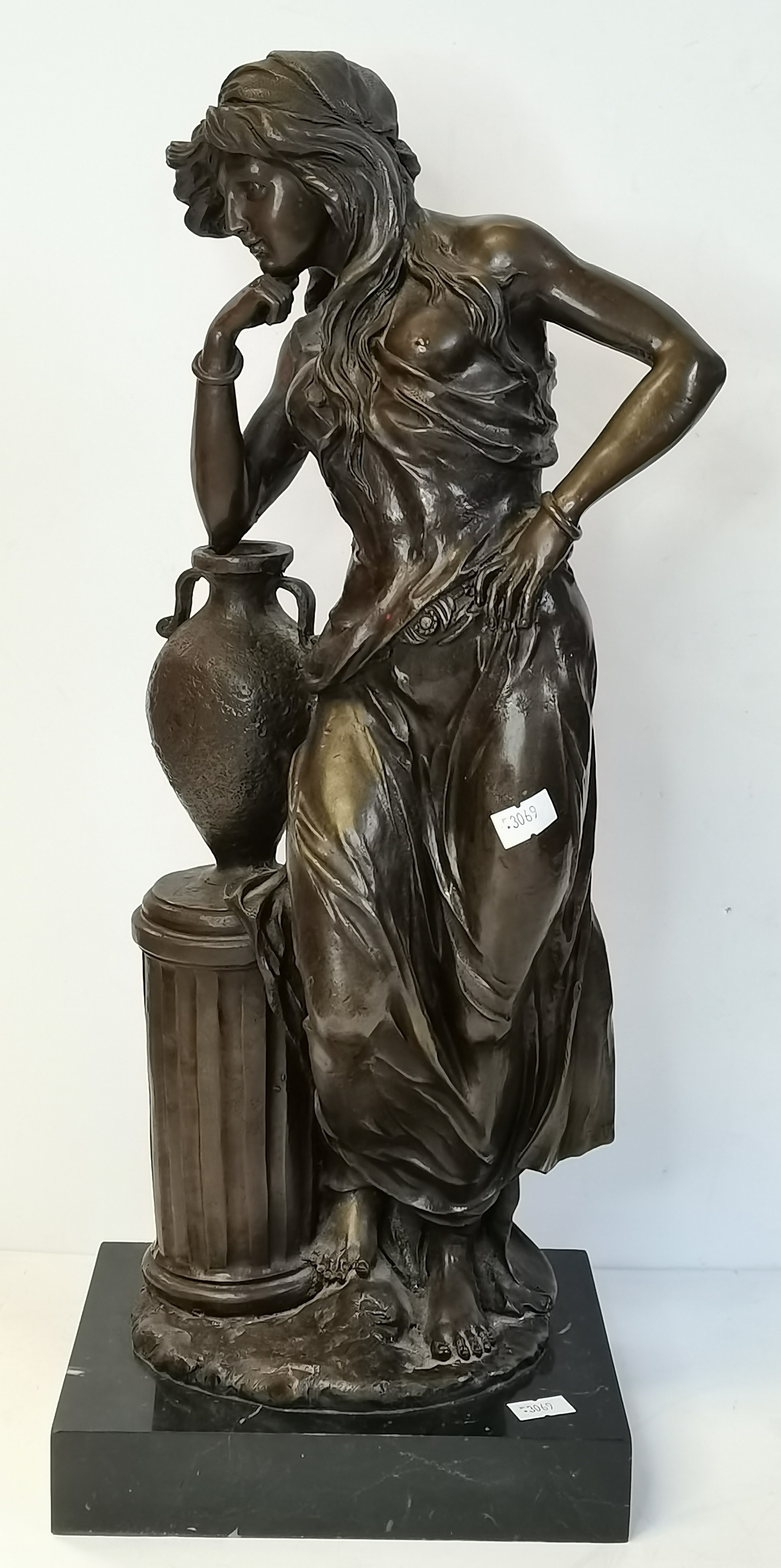 A bronze figure of a classical maiden