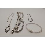 A group of silver necklaces and bracelets