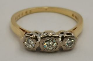An 18 carat gold three-stone diamond ring