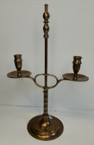 A vintage brass extending desk lamp with green shade