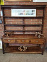 An antique oak dresser and rack