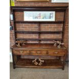 An antique oak dresser and rack