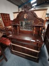 A Victorian chiffonier with decorative religious p